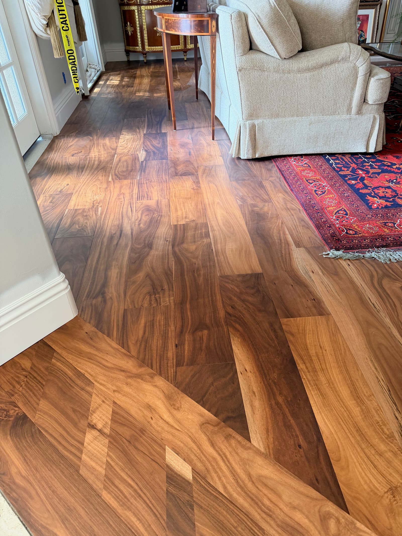 Acacia wide-plank floor in a furnished Carmel Valley living room during installation